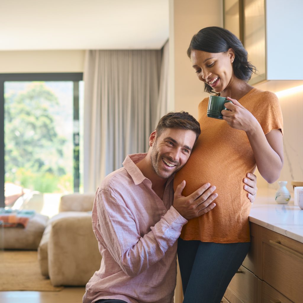 happy couple expecting a baby in the kitchen 2026 03 10 03 15 47 utc