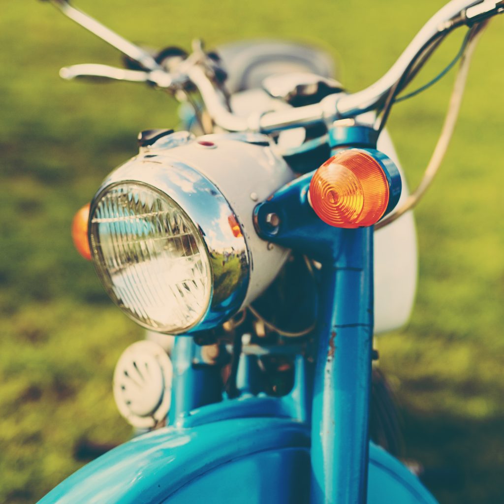 vintage motorcycle front detail on green backgroun 2026 03 10 04 47 32 utc