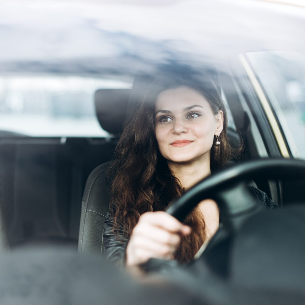 woman driving a car on a cloudy day 2026 03 10 04 47 44 utc