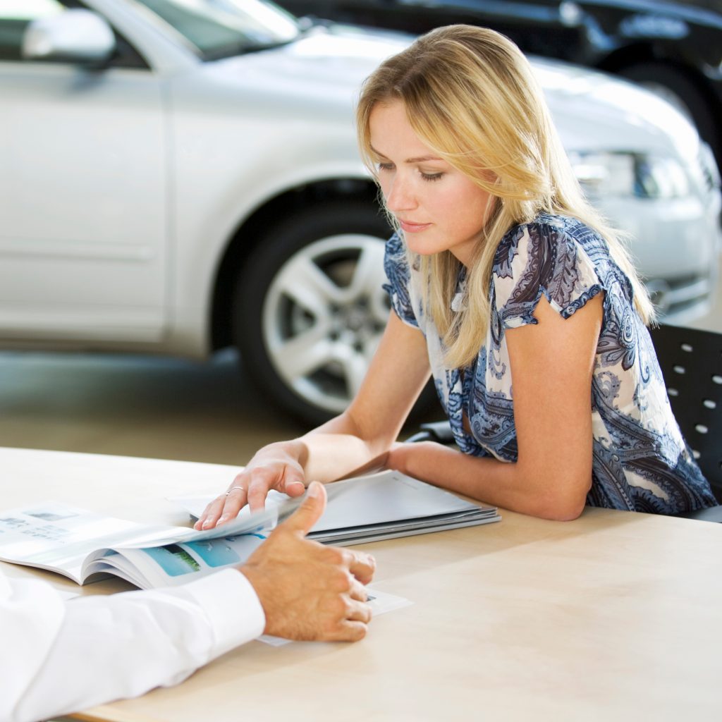 woman examines brochure with automotive profession 2026 01 11 09 45 48 utc